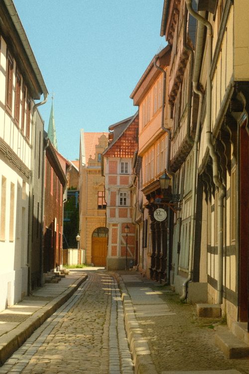 Free Explore the medieval charm of Quedlinburg's cobblestone streets and half-timbered houses. Stock Photo