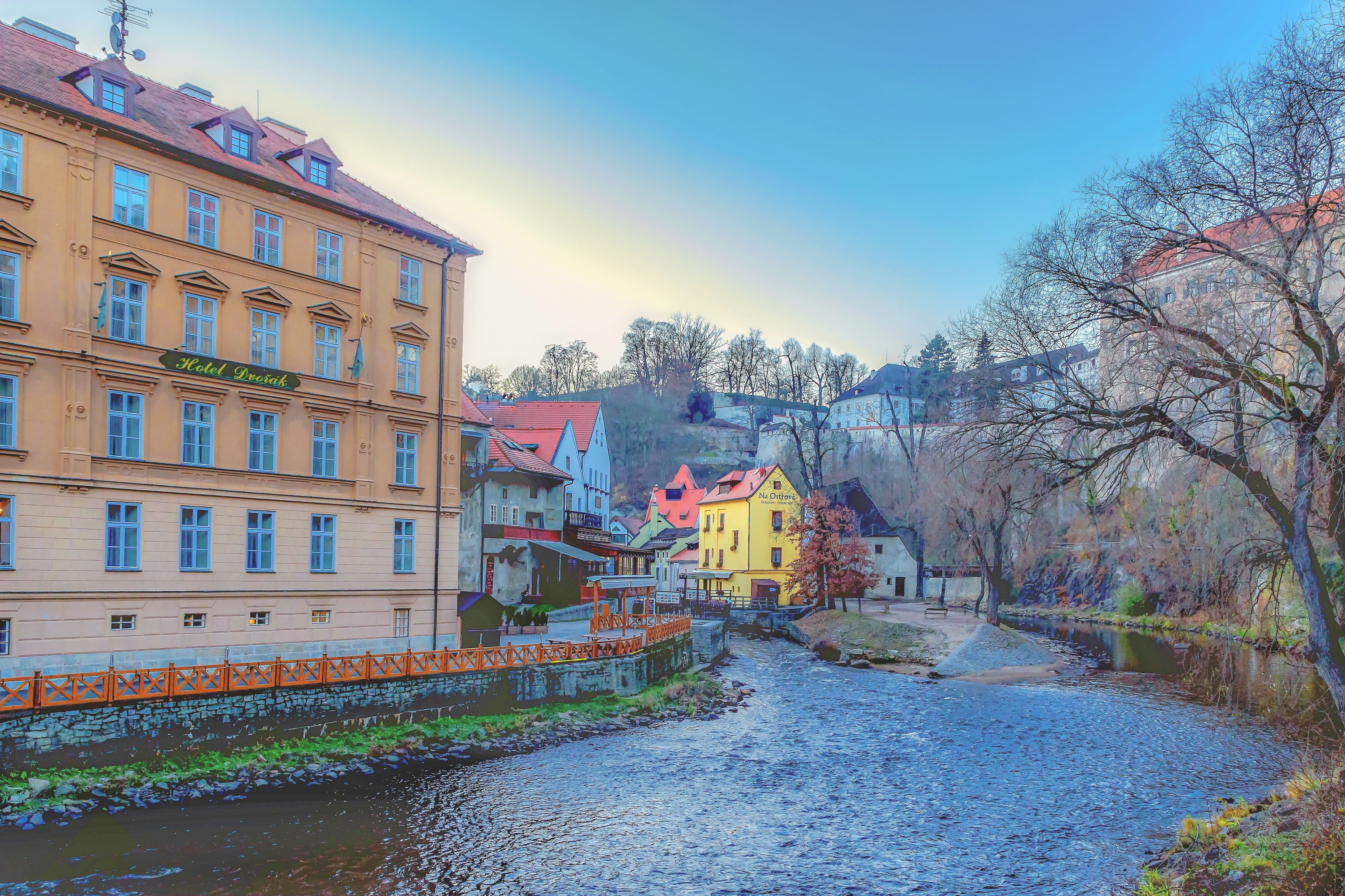Charming riverside view of Česky Krumlov's picturesque architecture in South Bohemia, Czech Republic.