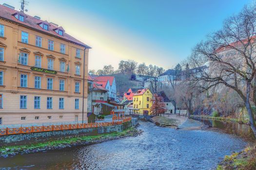 Charming riverside view of Česky Krumlov's picturesque architecture in South Bohemia, Czech Republic.
