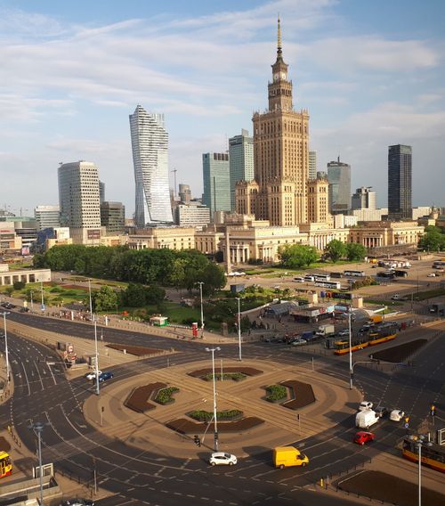 Free Aerial view of Warsaw's cityscape with the iconic Palace of Culture and surrounding skyscrapers. Stock Photo