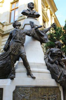 Bronze monument of Eugène Carrière with dynamic figures in Bucharest, Romania.