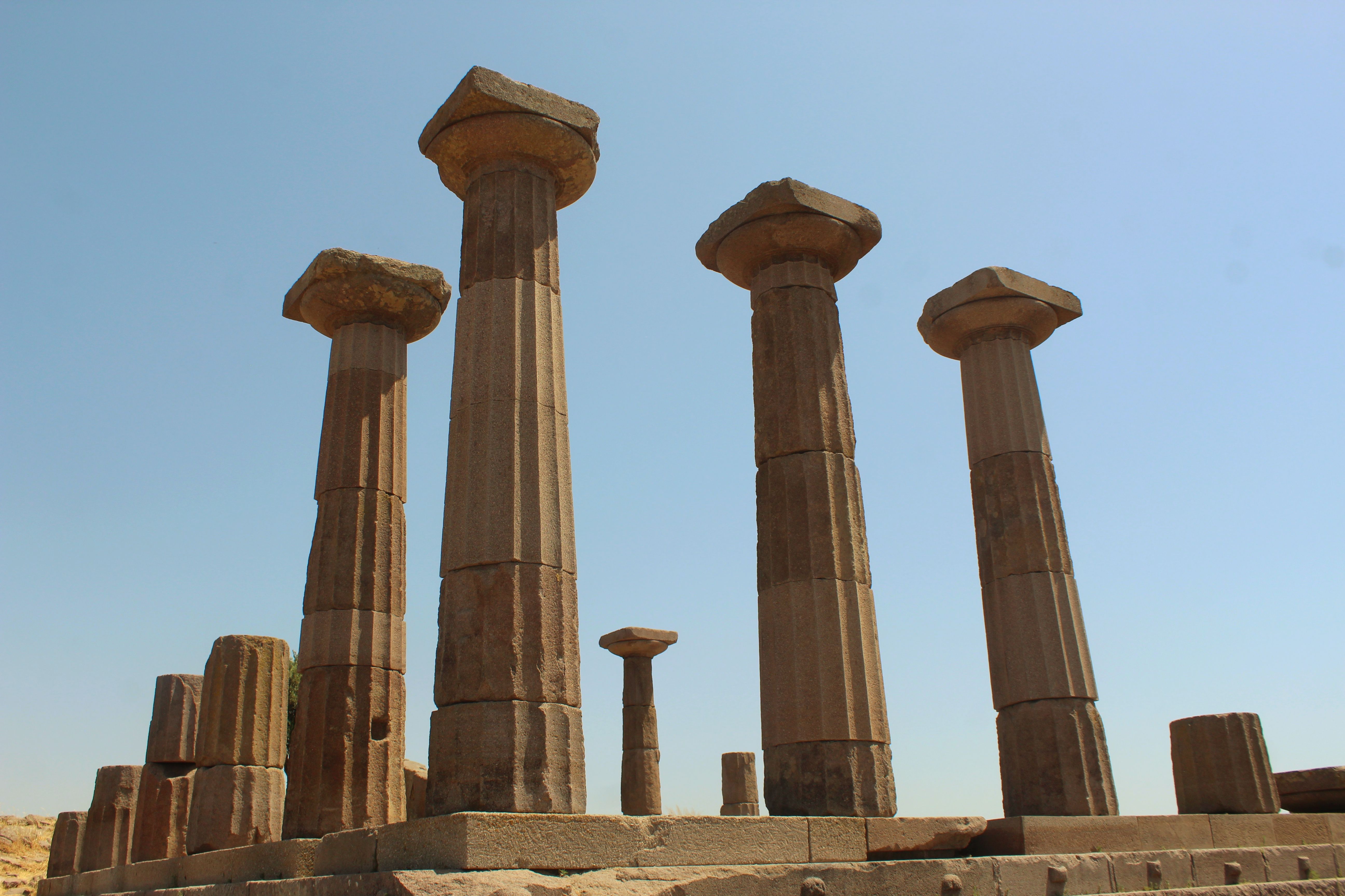 Ancient Temple Columns Under Clear Blue Sky · Free Stock Photo
