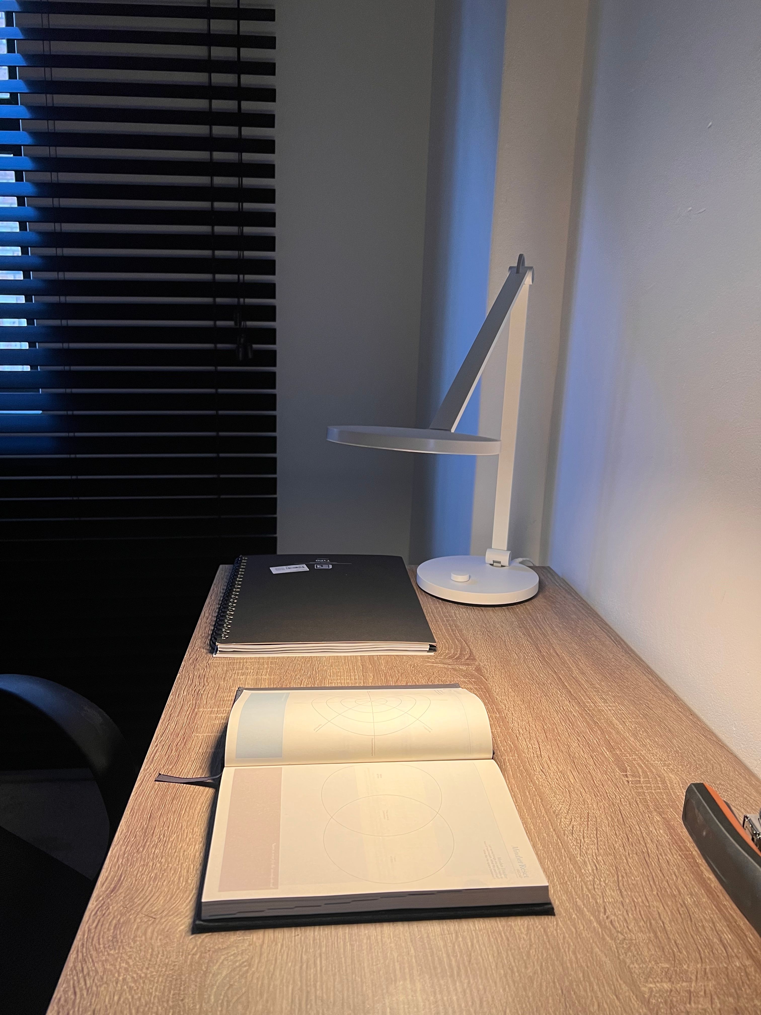 open finance textbook on a refined contemporary office desk
