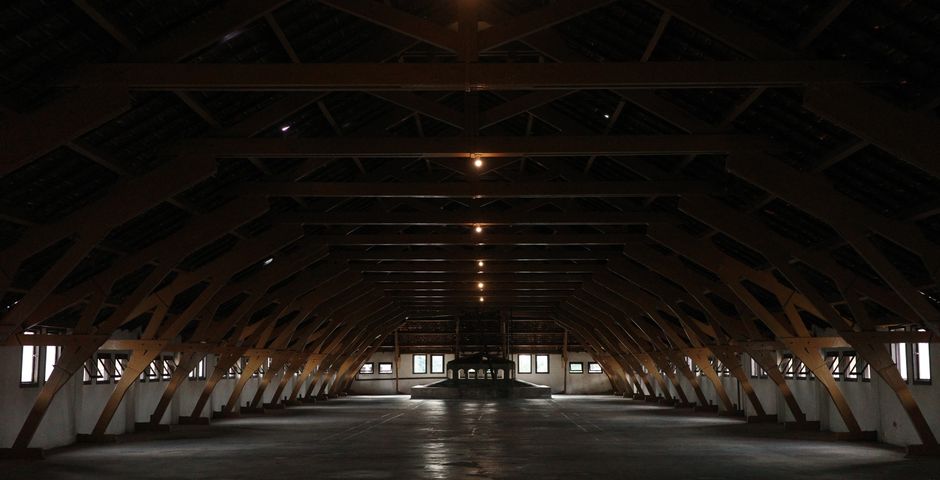Wooden roof beams in an attic space — the roof void is checked wherever there is safe access