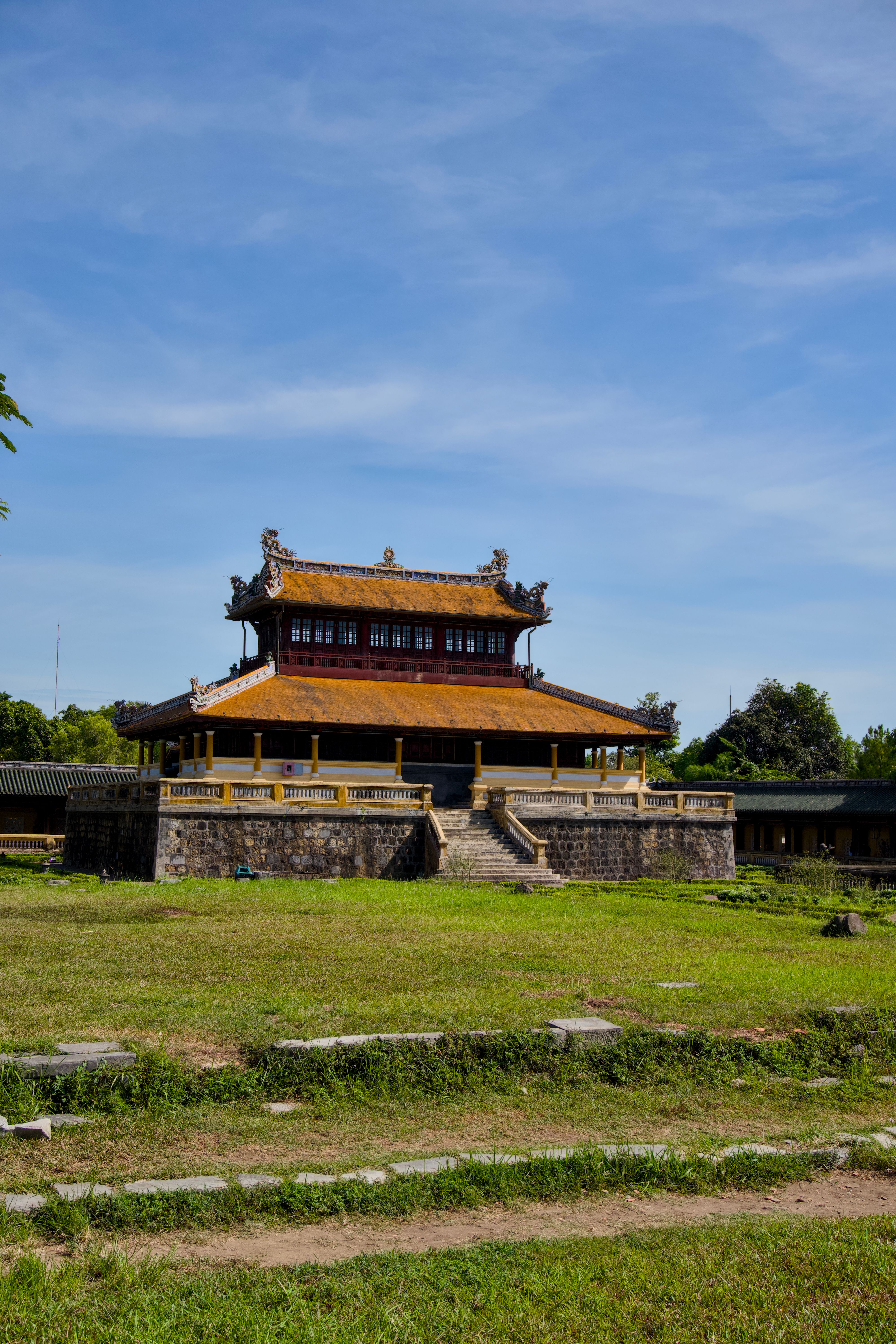 The Imperial City in Hue, Vietnam, showcasing ancient Vietnamese architecture under a clear blue sky.