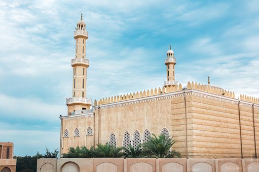 Beautiful view of a traditional mosque in Al Ahmadi, Kuwait, showcasing Islamic architecture against a clear blue sky.