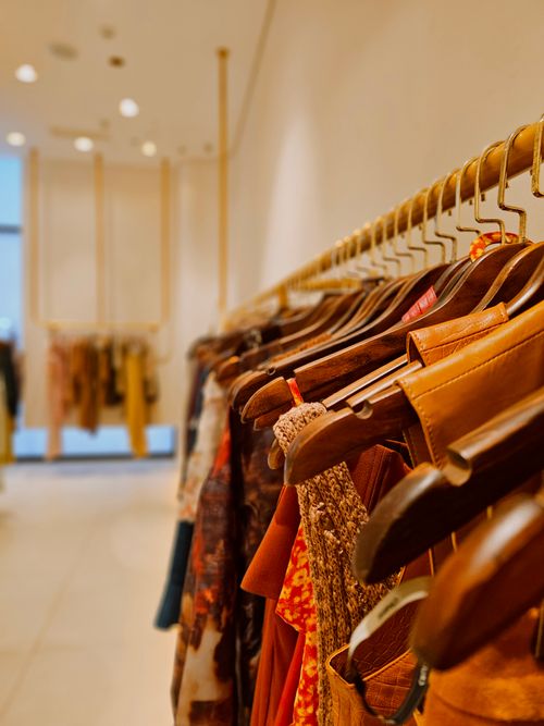 Book Dry Cleaning Munsiyah today – clean clothing on wooden hangers