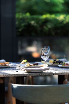 Daytime outdoor dining setup in a Kaliningrad café with stylish table arrangement.