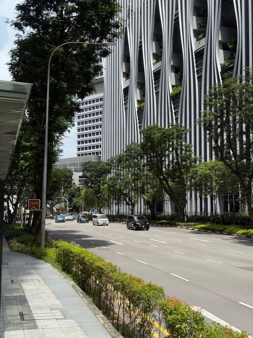 Free Explore sleek skyscrapers and bustling streets in downtown Singapore, showcasing modern urban design and greenery. Stock Photo