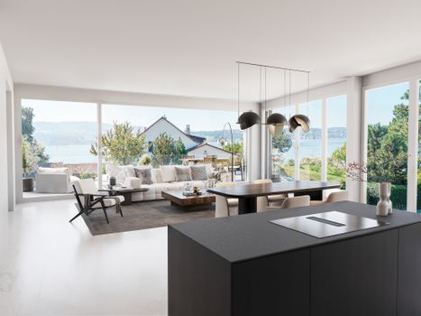 Spacious modern living room with panoramic lake view and elegant furnishings.