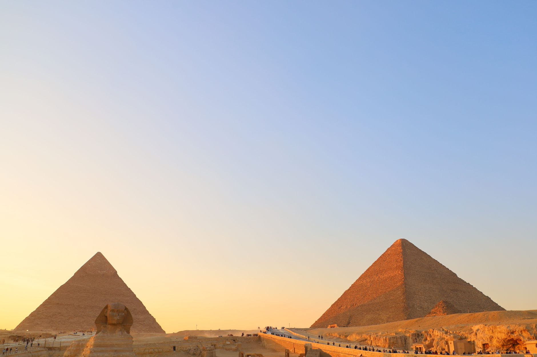 A majestic view of ancient pyramids at sunset symbolizing exclusive heritage access and ultra-luxury private travel.