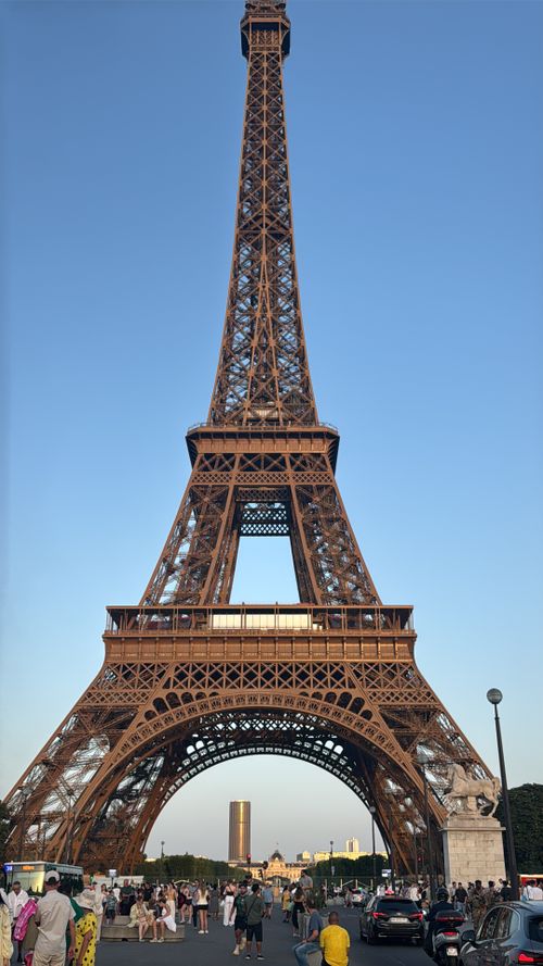 Free The iconic Eiffel Tower captured from a frontal view with a clear blue sky backdrop. Stock Photo