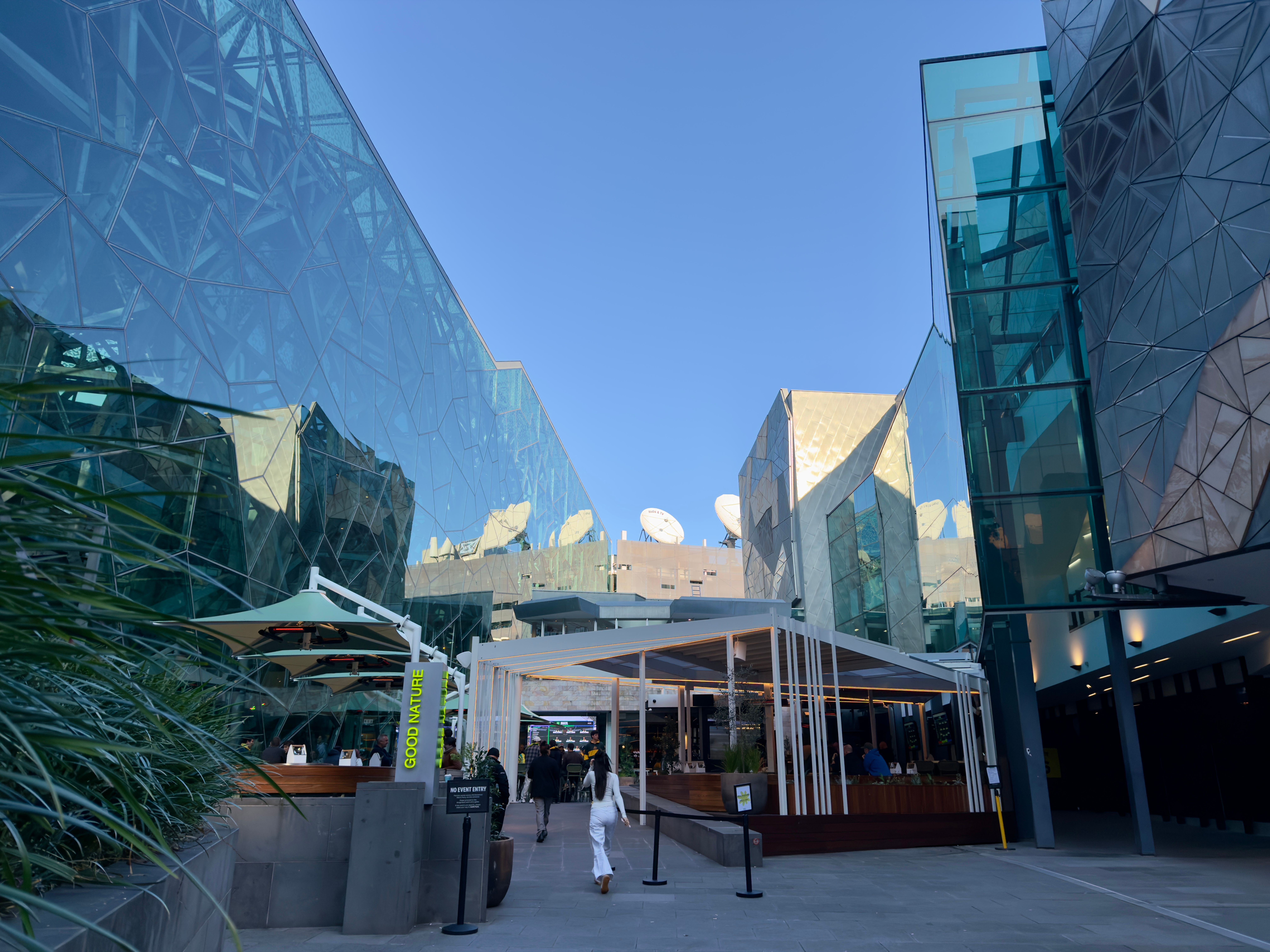 Explore the fusion of modern architecture and vibrant city life in Melbourne's urban landscape.