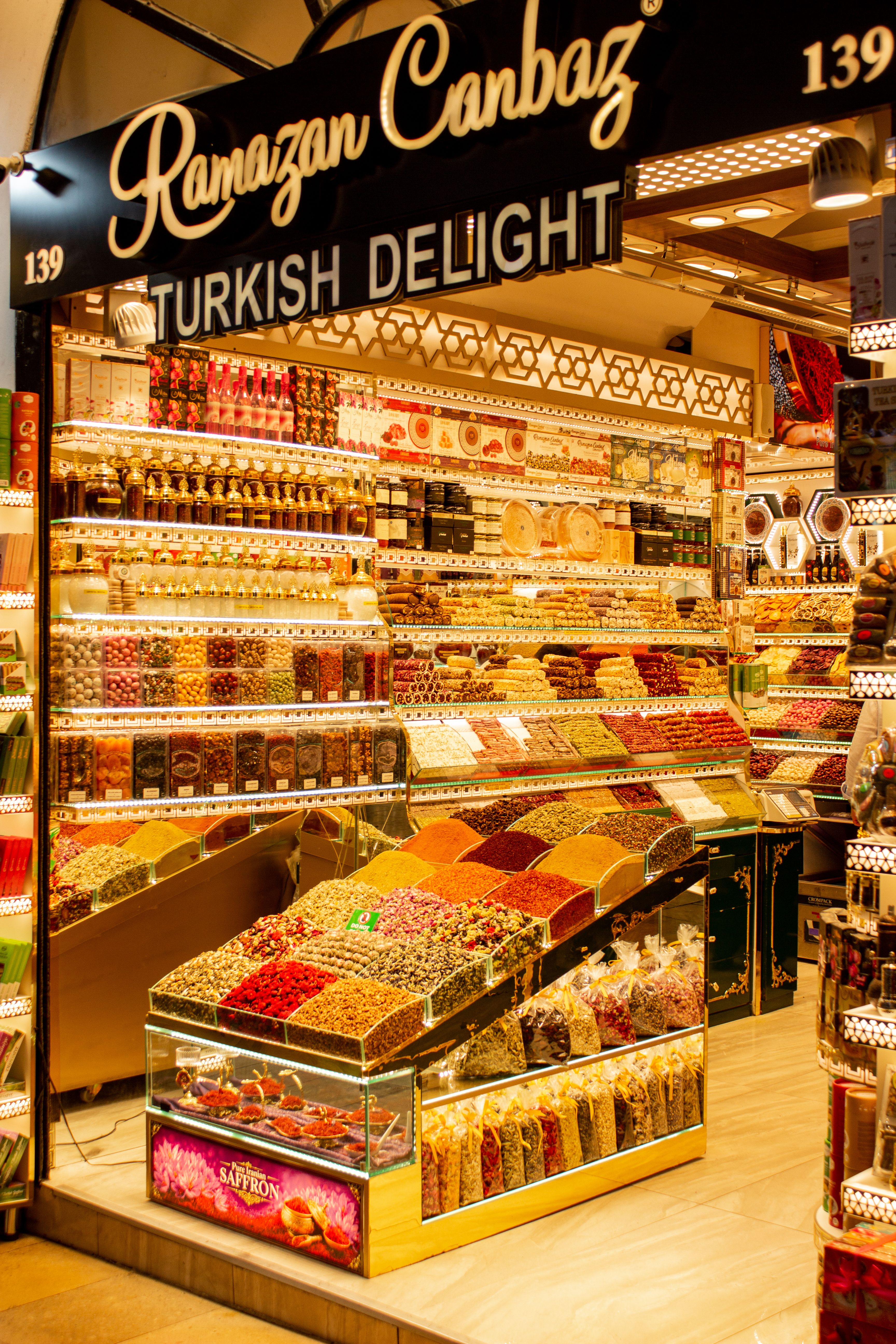 Explore a vibrant Turkish delight shop filled with colorful sweets in Istanbul's famous Spice Bazaar.