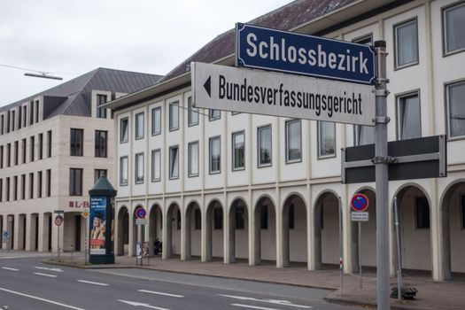 Street view in Karlsruhe showing signage for Schlossbezirk and Bundesverfassungsgericht.