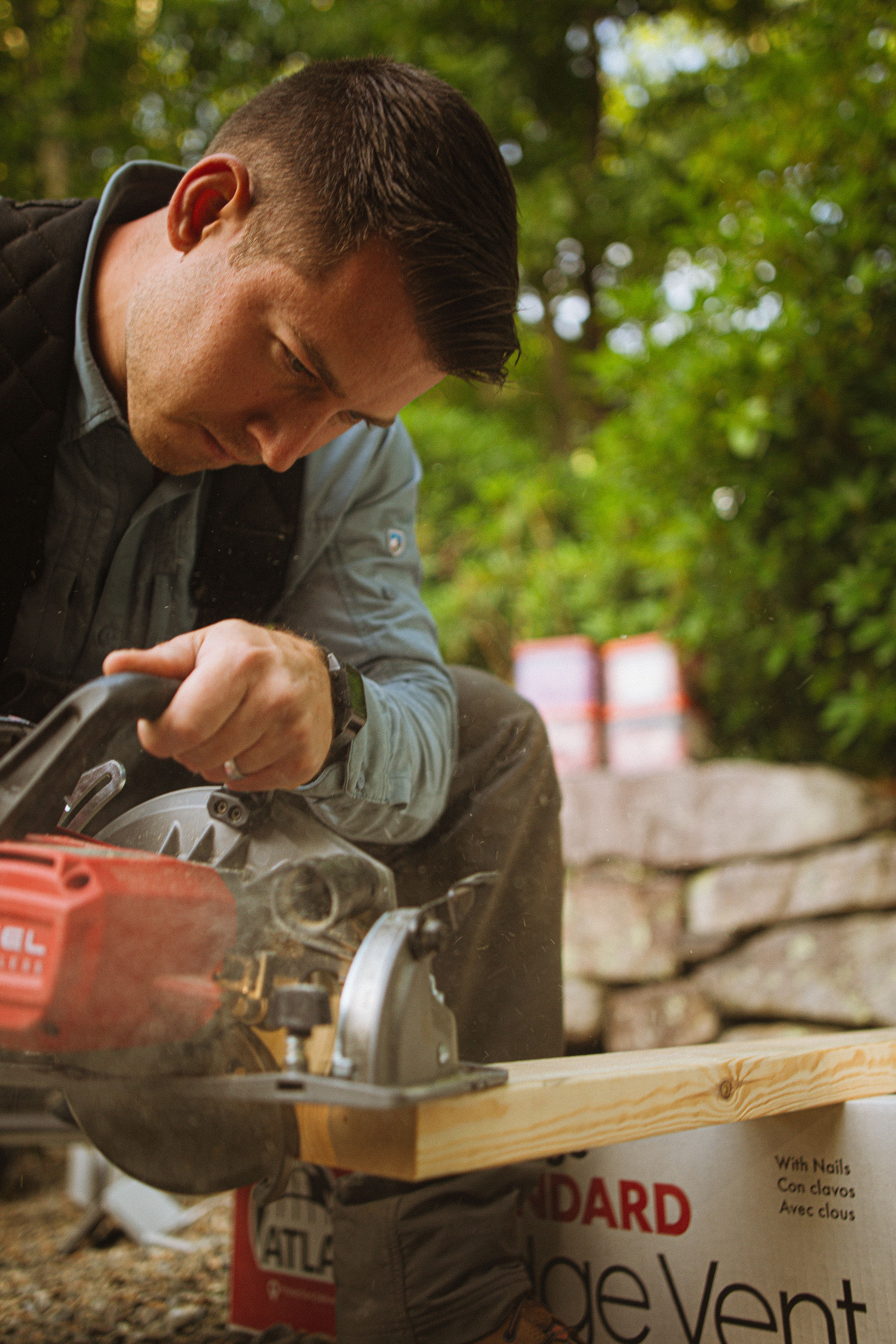 A skilled tradesman in North Carolina working with a circular saw on a construction site.