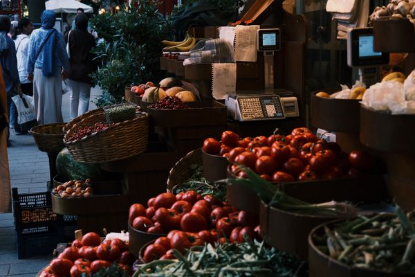Produce display at an outdoor market — photo by Helin Gezer on Pexels