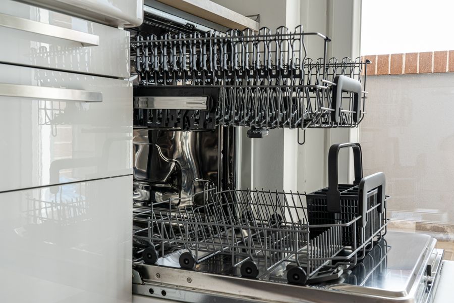 Empty dishwasher rack with the door open