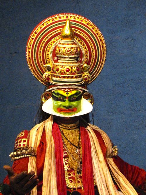 Free Colorful Kathakali dancer wearing ornate costume and makeup, performing a traditional dance in India. Stock Photo