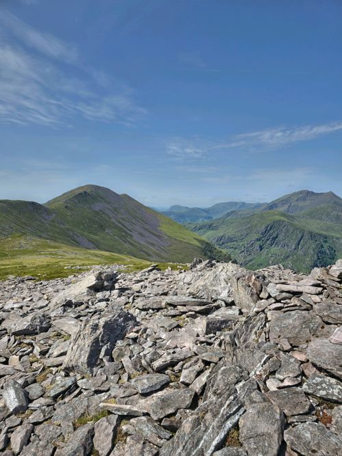Free Breathtaking view of rocky terrain and rolling mountains in Kerry, Ireland under clear blue skies. Stock Photo