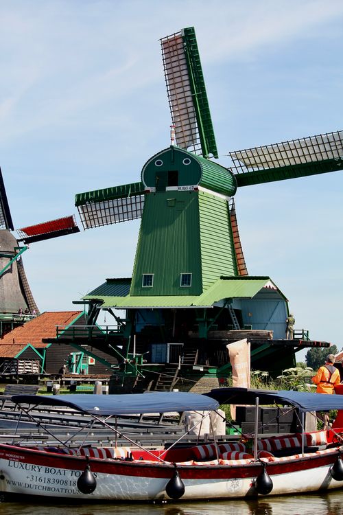 Free Explore the traditional windmills and scenic waterways of Zaanse Schans, Noord-Holland. Stock Photo