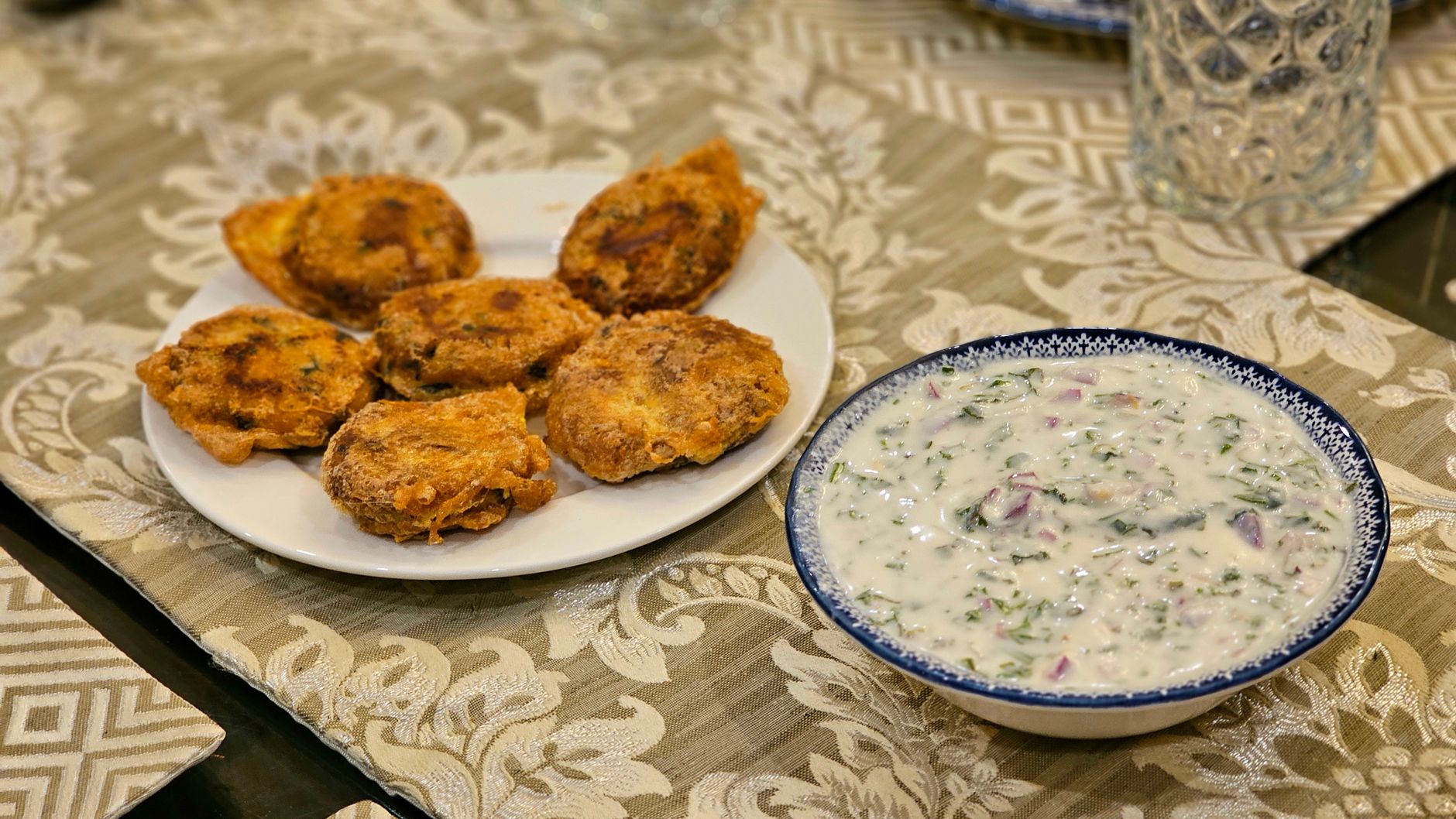 Serving ricotta fritters with a honey drizzle on a rustic plate