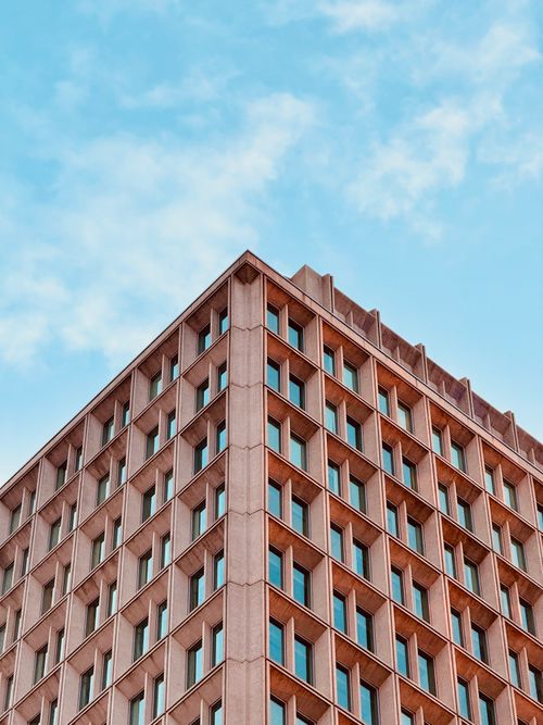 Modern Architectural Building with Geometric Design · Free Stock Photo