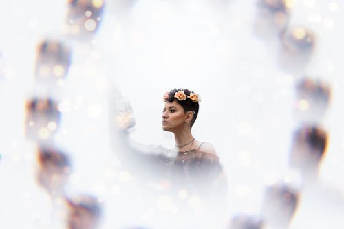 Woman in Floral Crown Wearing Black Dress