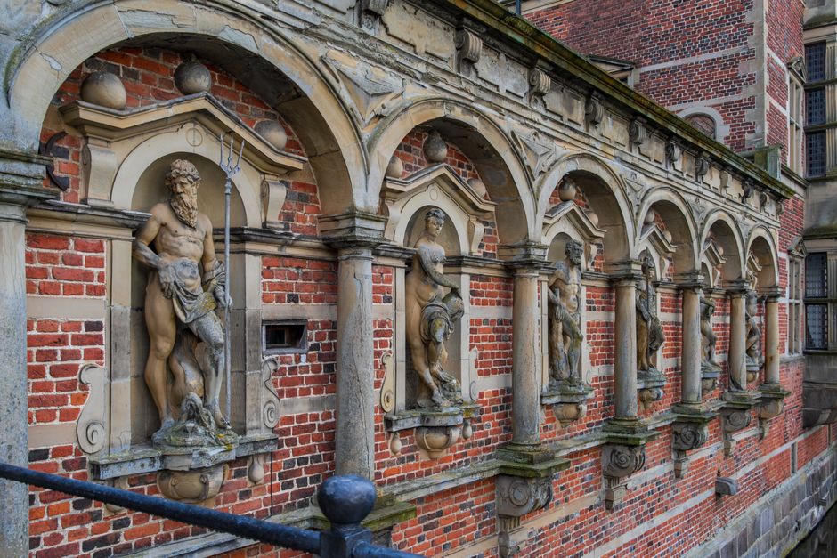 Detail view of sculptures at Frederiksborg Castle, Hillerød, Denmark, showcasing Renaissance architecture.