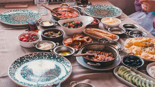 Free A vibrant spread of traditional Turkish breakfast dishes with tea in Şanlıurfa setting. Stock Photo