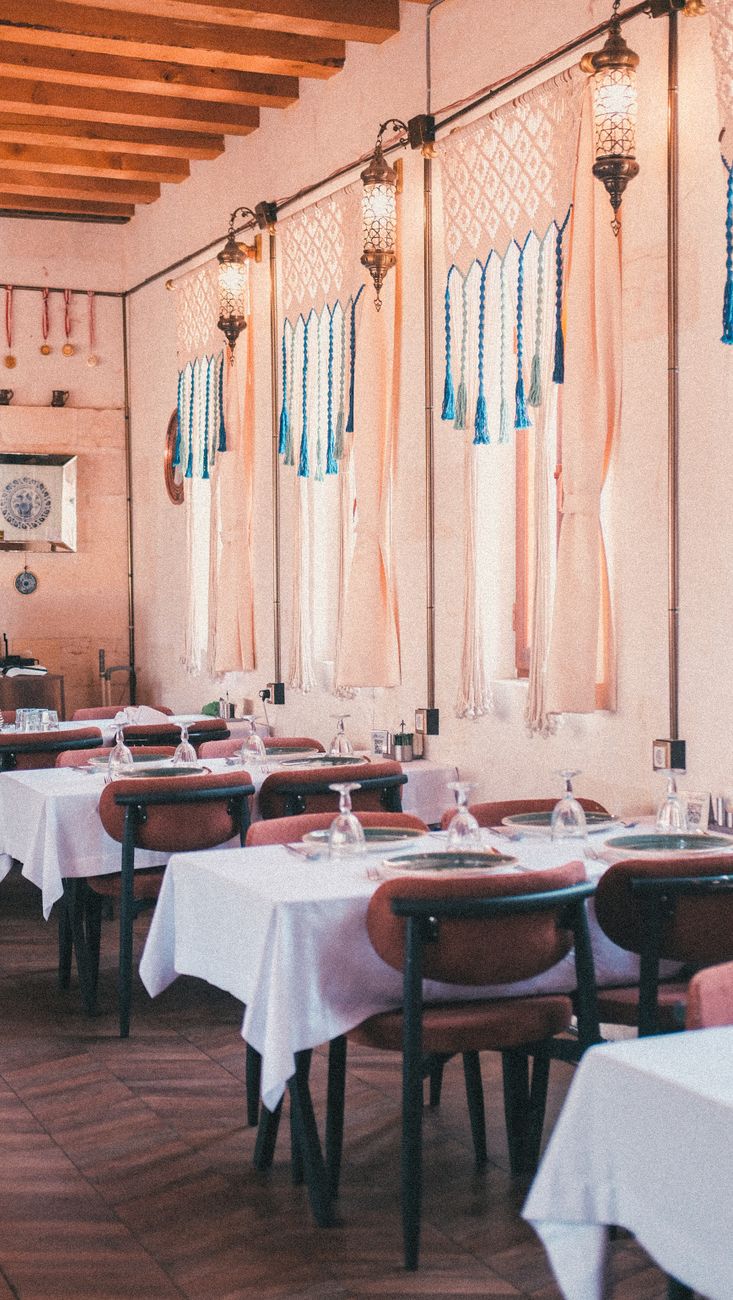 cozy mediterranean restaurant with wooden tables and warm natural light
