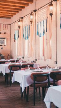 Charming Mediterranean-style restaurant interior with decorative elements in Şanlıurfa, Türkiye.