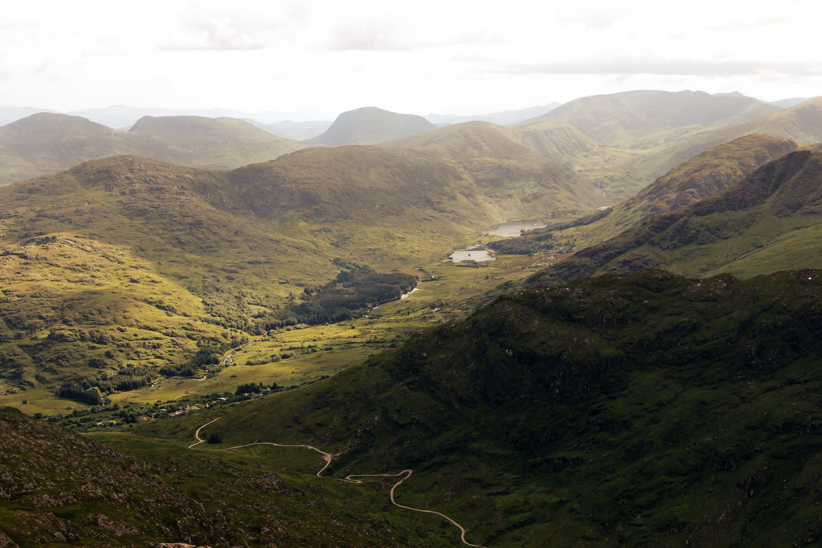 Aerial view of the green landscapes and mountains of Killarney National Park in Ireland