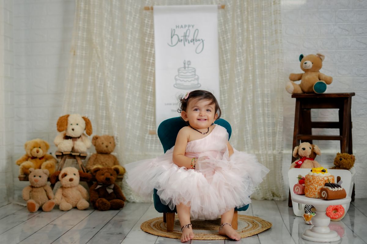 Baby girl in a pink tutu birthday outfit