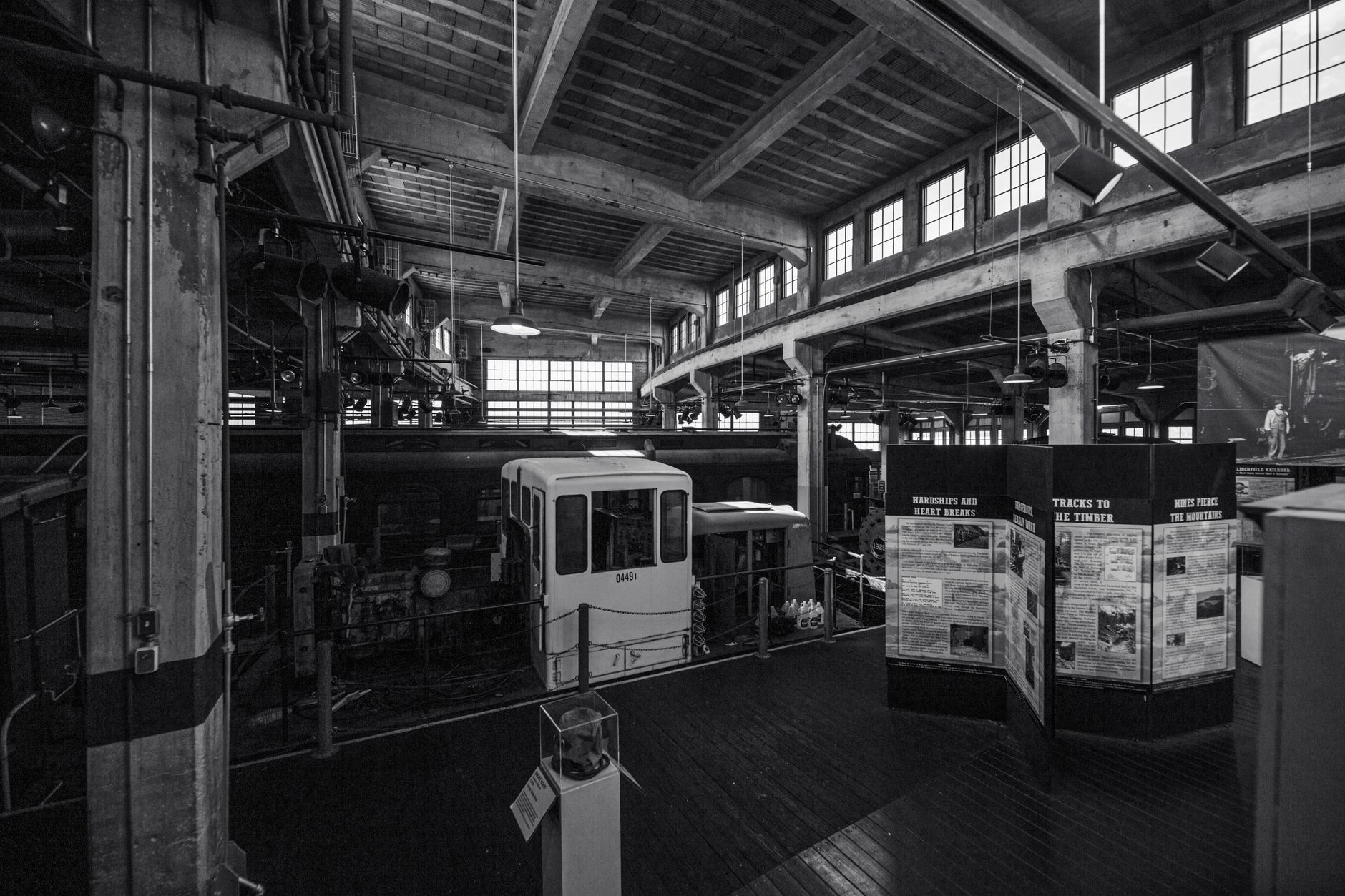 Elegant black and white photo of a historic train museum interior showcasing vintage design.