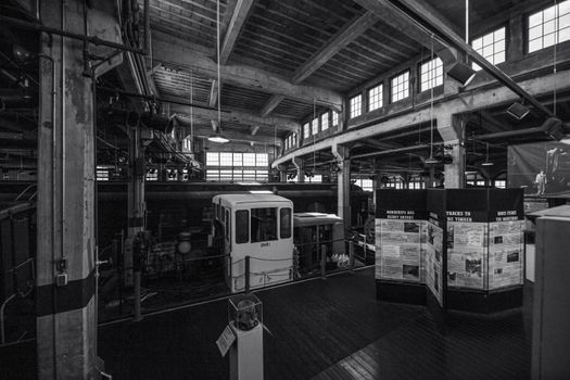 Elegant black and white photo of a historic train museum interior showcasing vintage design., free online jigsaw puzzle on JigsawPuzzlesFreeOnline.org