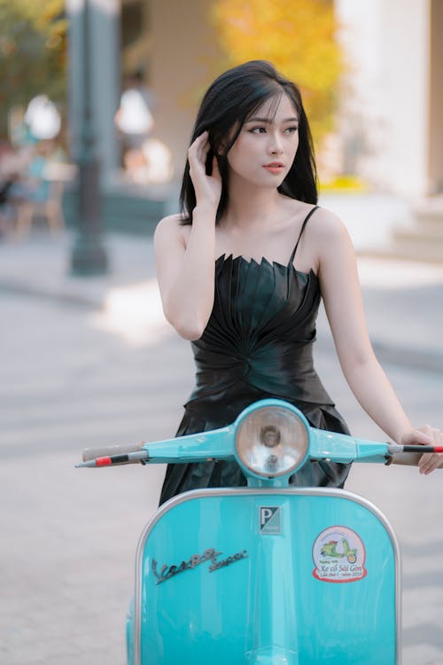 Woman In Green Spaghetti Strap Dress Riding On Motorcycle