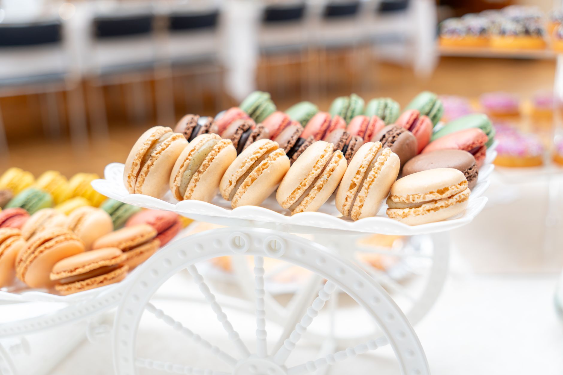 A vivid assortment of French macarons presented on a decorative tray, perfect for events.