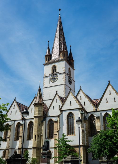 Free Stunning view of the Evangelical Lutheran Cathedral in Sibiu, Romania, against a clear blue sky. Stock Photo