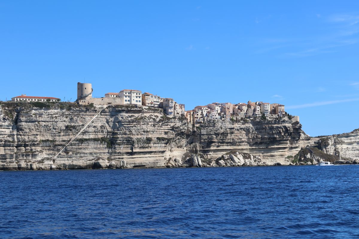 Bonifacio's old town and Genoese tower along the white cliffs, from the sea