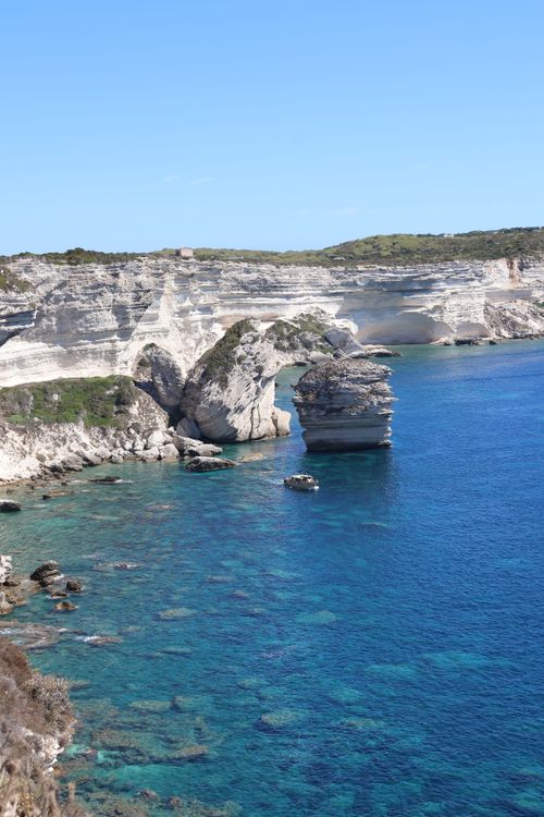 Free Scenic view of the white limestone cliffs and blue waters in Bonifacio, Corsica. Stock Photo