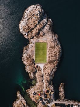 Stunning bird's-eye view of Henningsvær soccer field on a rocky island.
