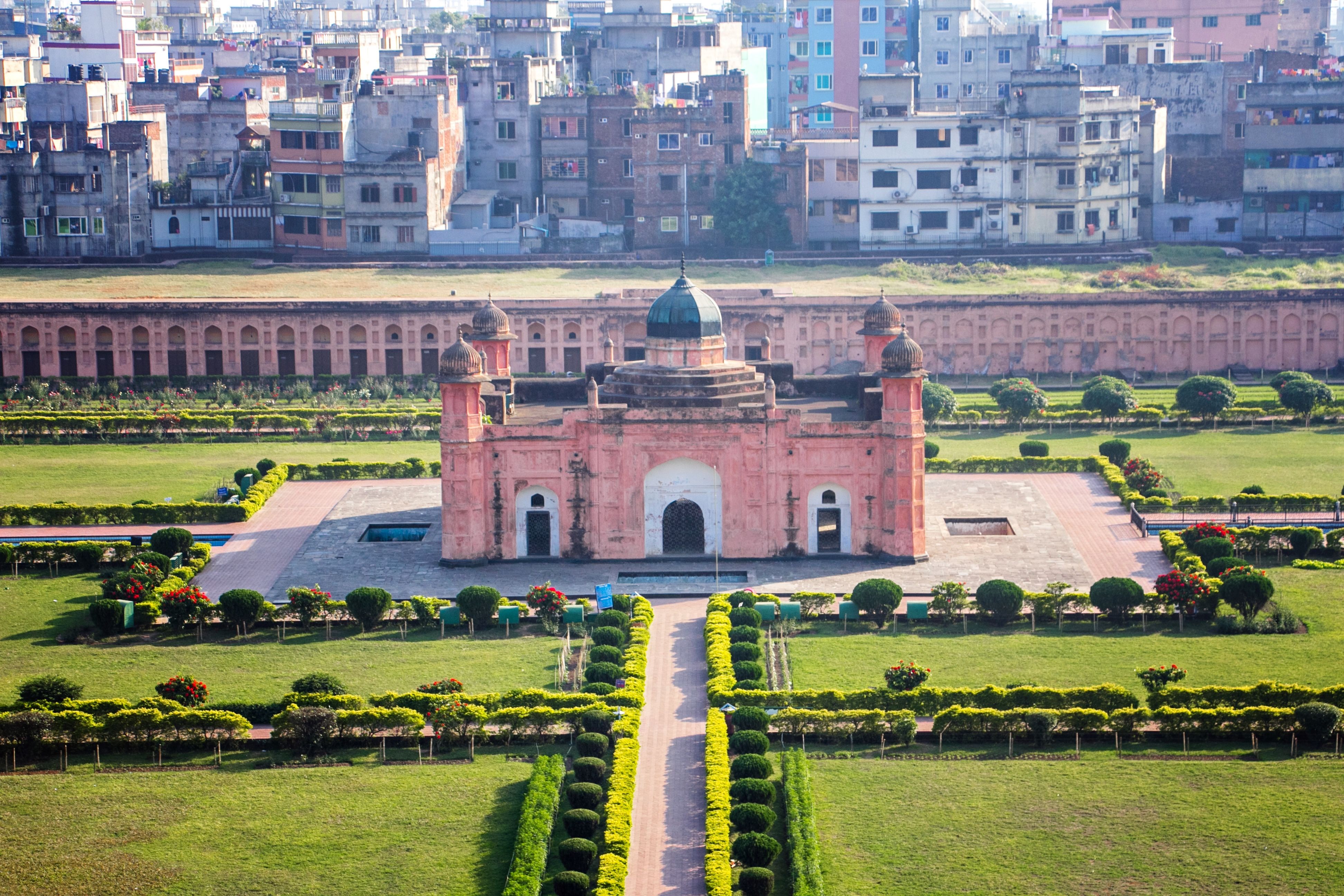 Aerial shot of the historic Lalbagh Fort in Dhaka surrounded by gardens and cityscape.