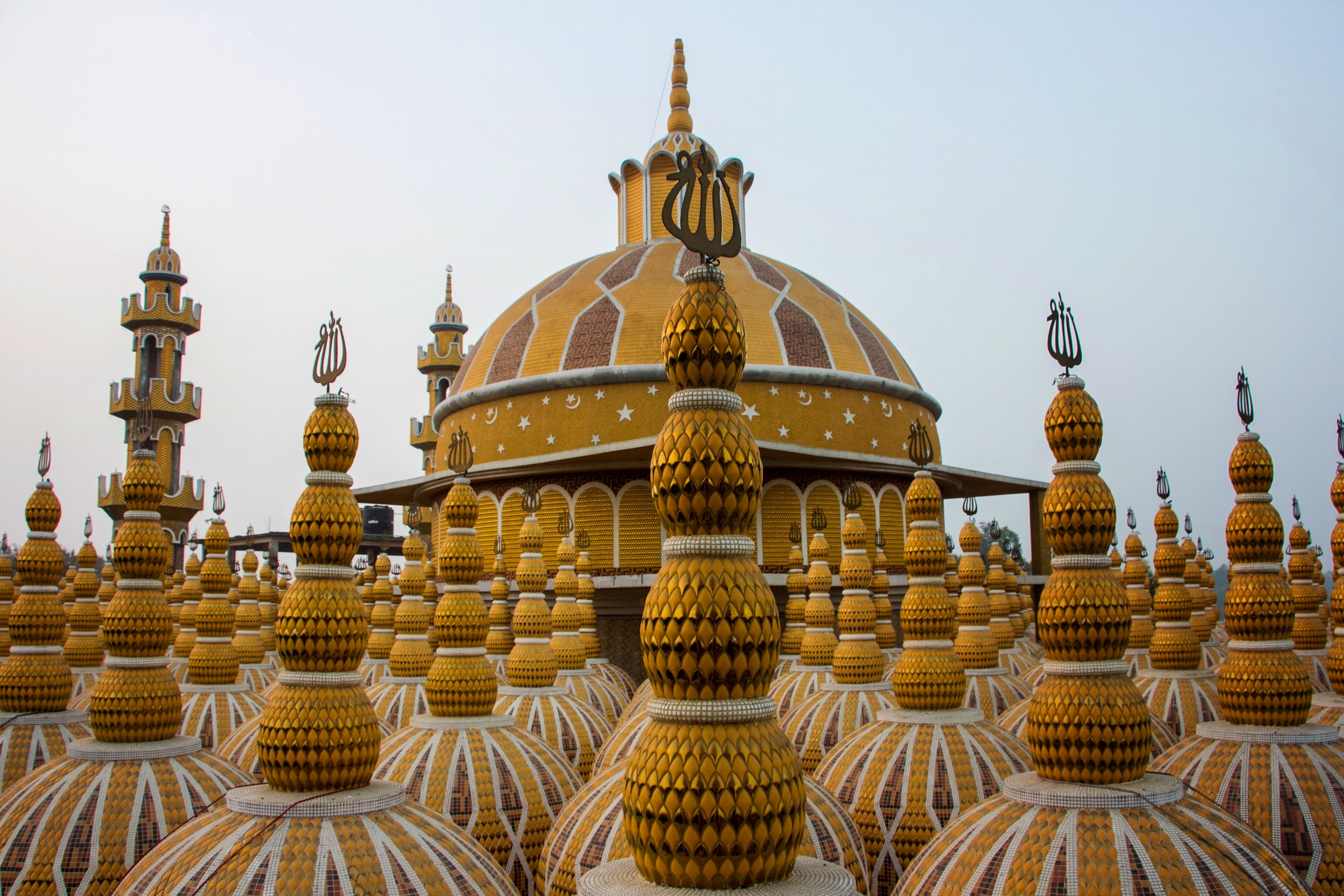 Colorful domes of a mosque with intricate patterns, showcasing unique architecture.