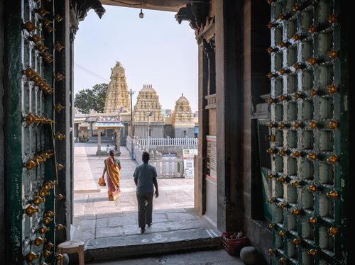 Free View through ornate doors to a historic temple complex in Kanchipuram, India. Stock Photo