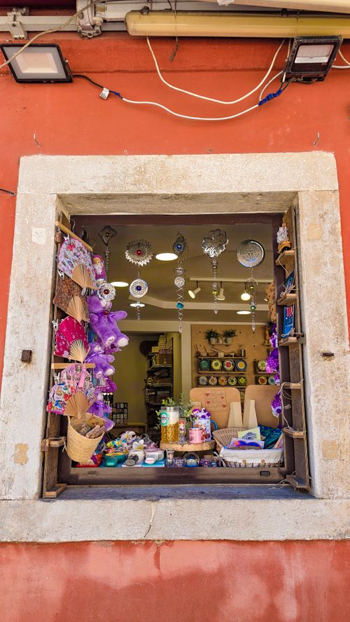 Free Colorful crafts and souvenirs displayed at a window in a quaint Istrian village. Stock Photo