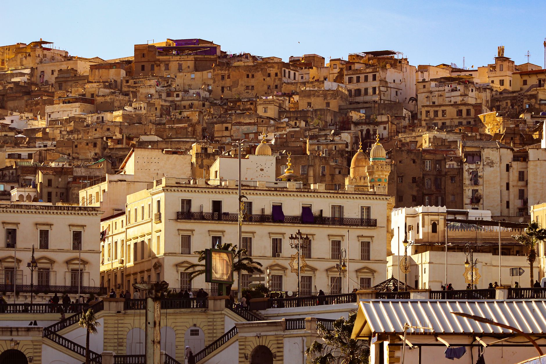 Scenic view of the historic Kasbah in Algiers, capturing the old architecture at sunset with warm tones.