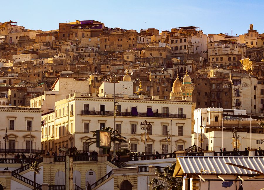 Scenic view of the historic Kasbah in Algiers, capturing the old architecture at sunset with warm tones.