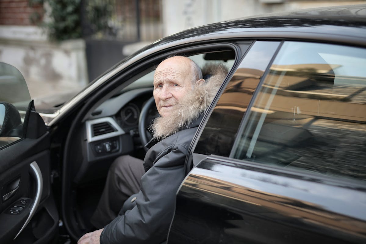 Man in Black Leather Jacket in Car