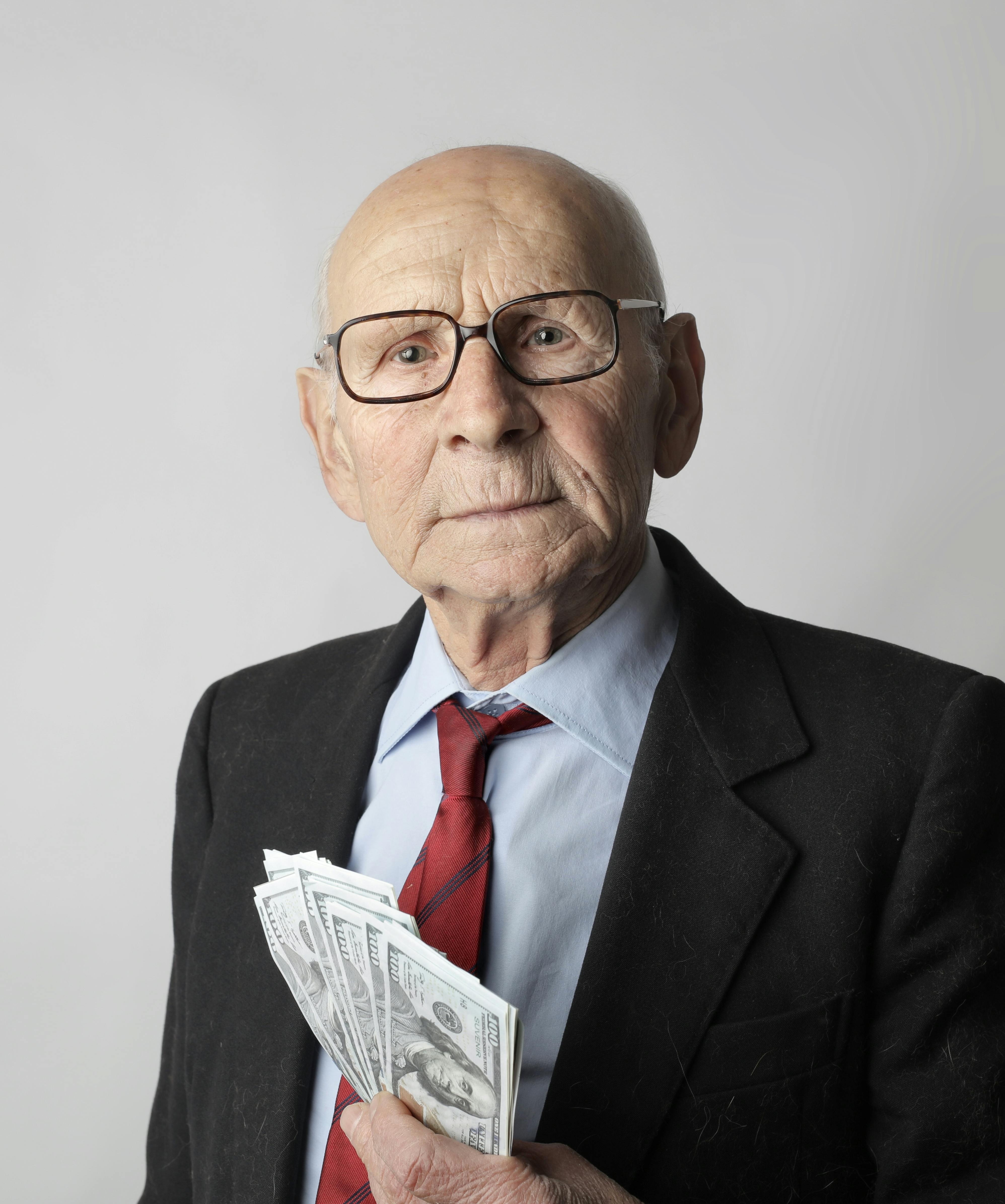 man in black suit wearing eyeglasses